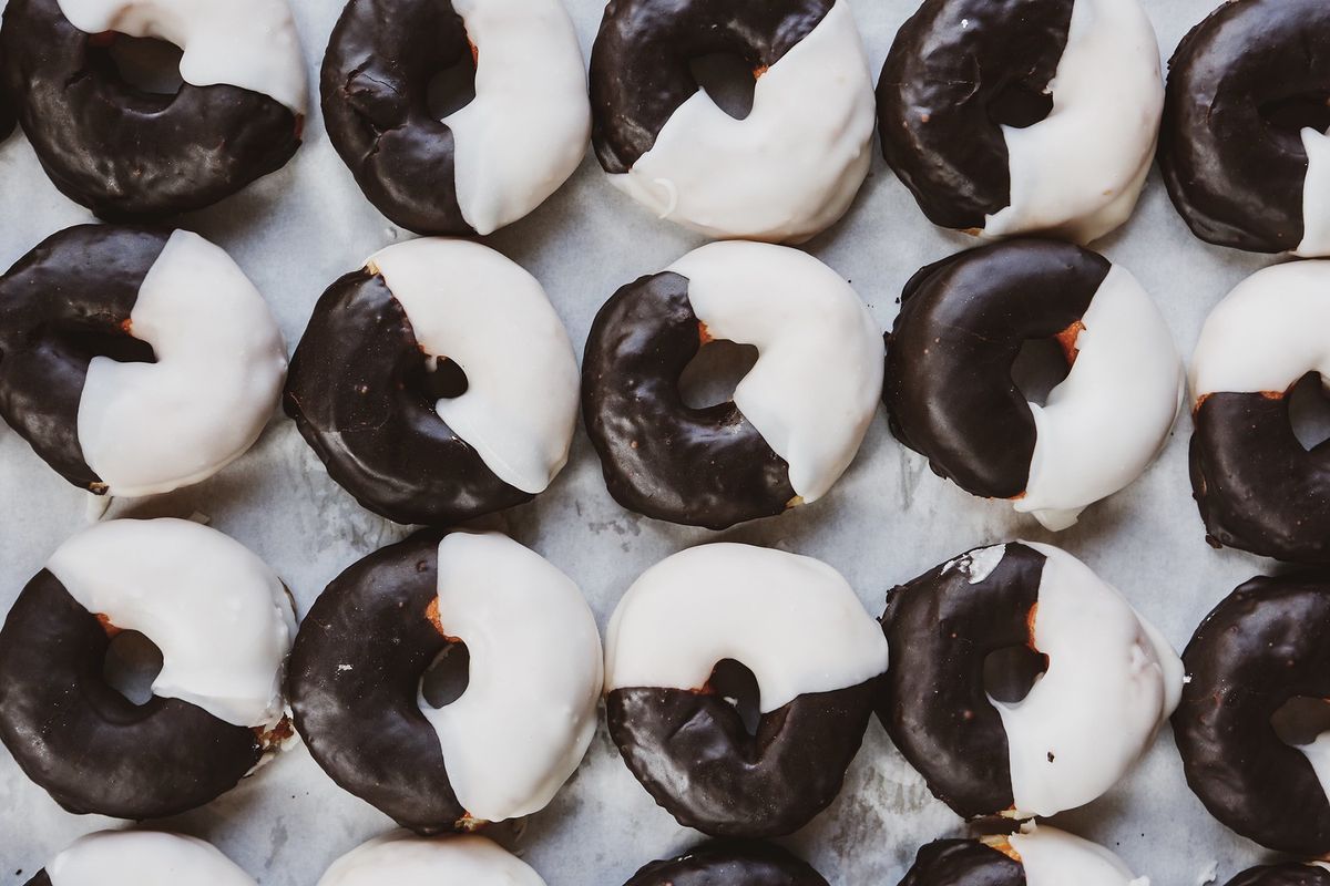 A full sheet of black-and-white glazed doughnuts from Call Your Mother