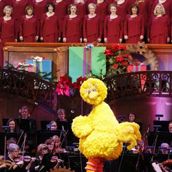 The Mormon Tabernacle Choir performs with the "Sesame Street" Muppets during its annual Christmas concert in Salt Lake City Thursday, Dec. 11, 2014.