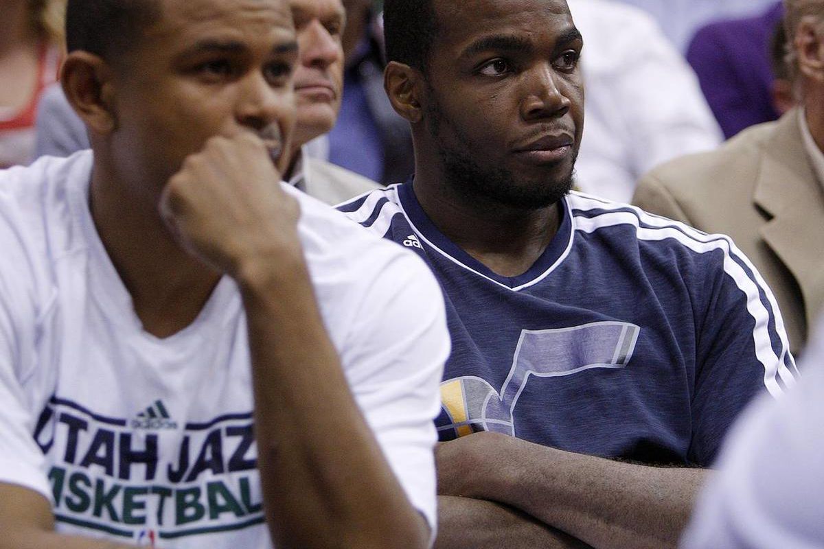 Utah's Earl Watson and Paul Millsap watch from the bench as the Utah Jazz and Denver Nuggets play Wednesday, April 3, 2013 in Salt Lake City at EnergySolutions Arena. Denver beat the Jazz 113-96.