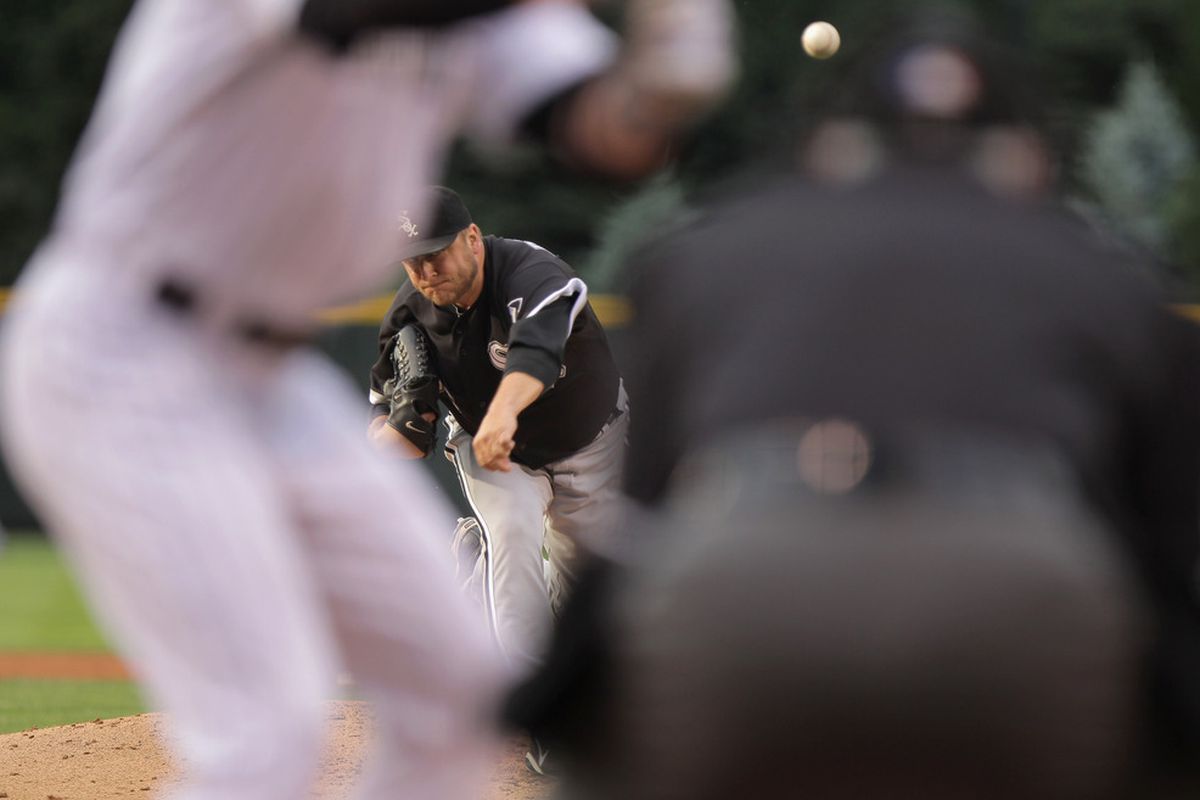DENVER, CO - JUNE 29:  Starting pitcher Mark Buehrle #56 of the Chicago White Sox delivers against the Colorado Rockies during Interleague play at Coors Field on June 29, 2011 in Denver, Colorado.  (Photo by Doug Pensinger/Getty Images)