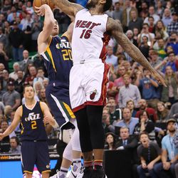 Utah Jazz forward Gordon Hayward (20) shoots for the win but misses on the defense from Miami Heat forward James Johnson (16) in Salt Lake City on Thursday, Dec. 1, 2016. Miami won 111-110.