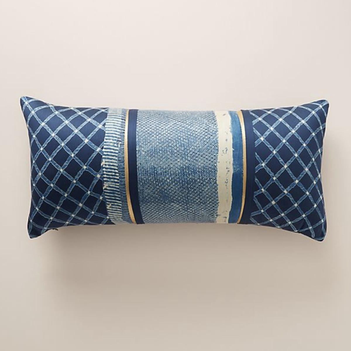 A long, rectangular throw pillow that features an indigo blue-colored design. 