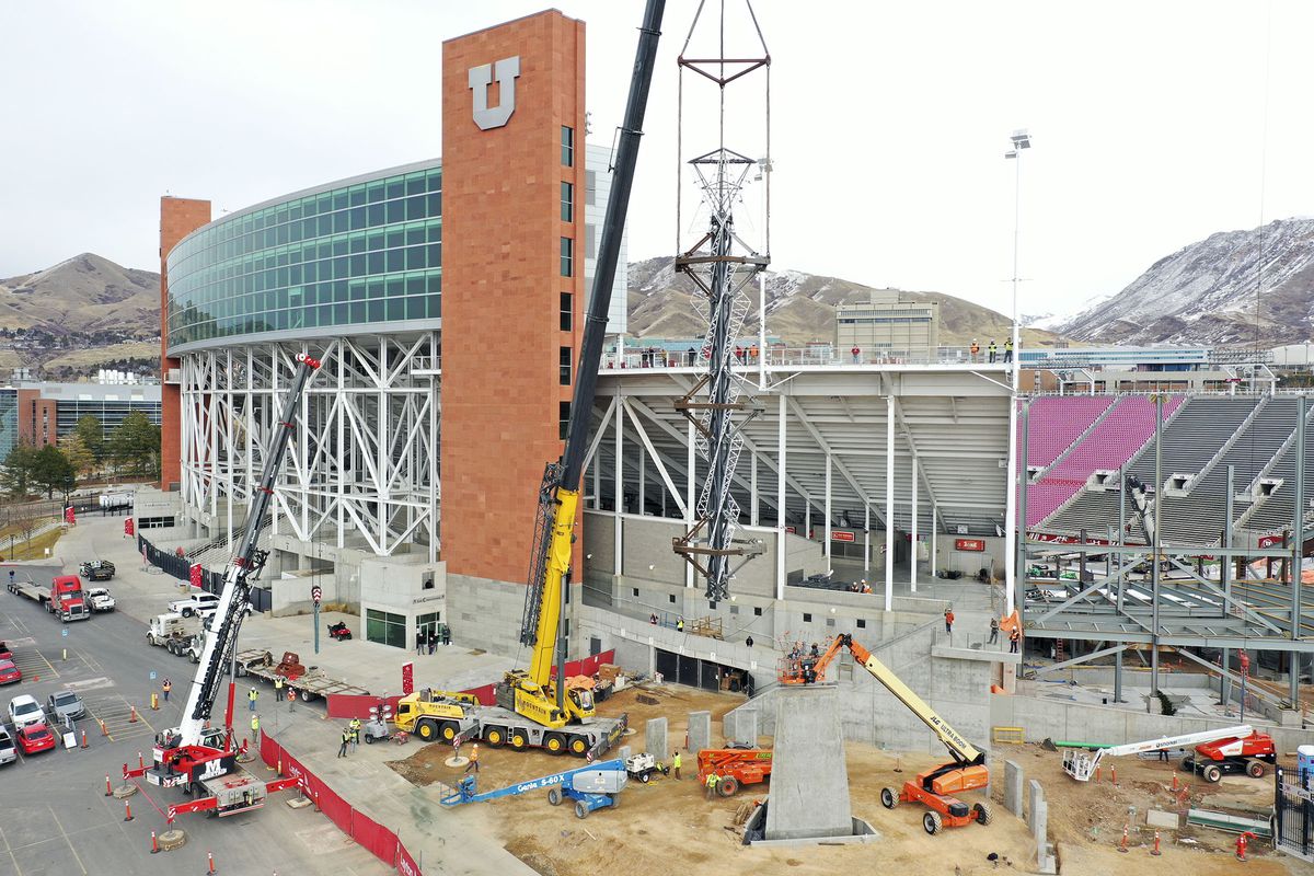 Construction crews use a crane to reinstall the 2002 Olympic cauldron outside of the University of Utah’s Rice-Eccles Stadium in Salt Lake City on Friday, Jan. 29, 2021.