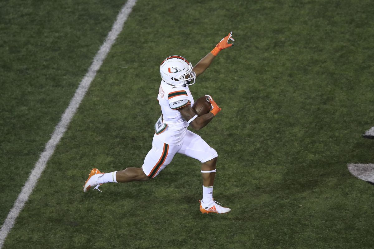 Jaylan Knighton of the Miami Hurricanes runs for a touchdown in the third quarter against the Louisville Cardinals at Cardinal Stadium on September 19, 2020 in Louisville, Kentucky.