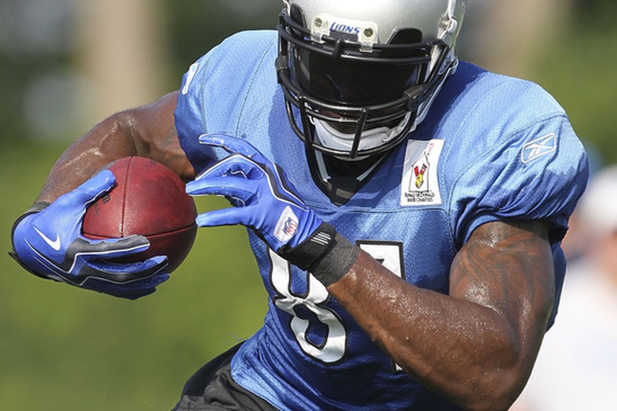 Calvin Johnson runs through the morning drills at the Lions training facility on August 1, 2011.