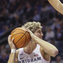 Brigham Young Cougars forward Caleb Lohner (33) looks for an open teammate as BYU plays Loyola Marymount in an NCAA basketball game at Marriott Center in Provo on Thursday, Feb. 24, 2022.  