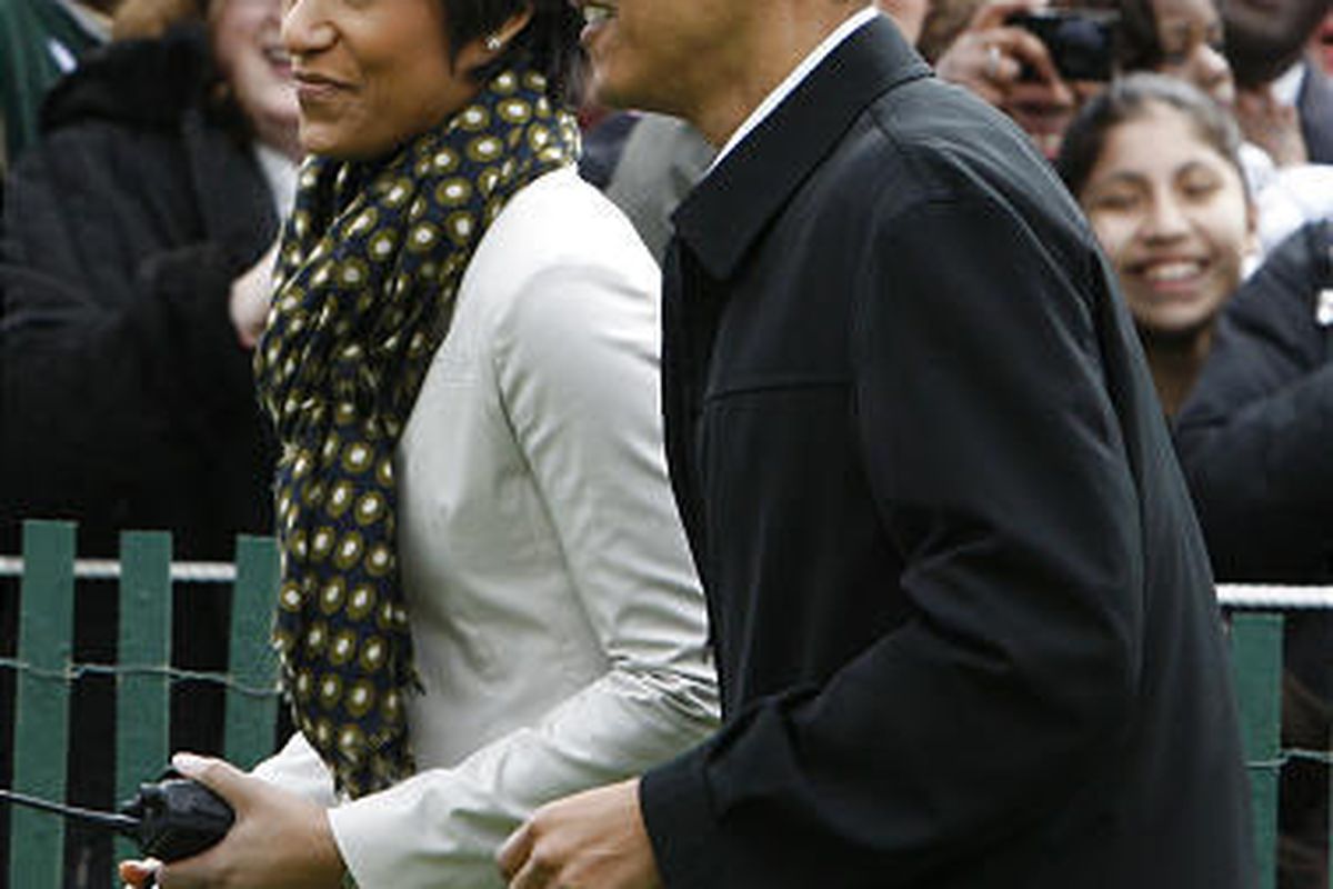 President Barack Obama walks with White House social secretary Desiree Rogers at event last April.