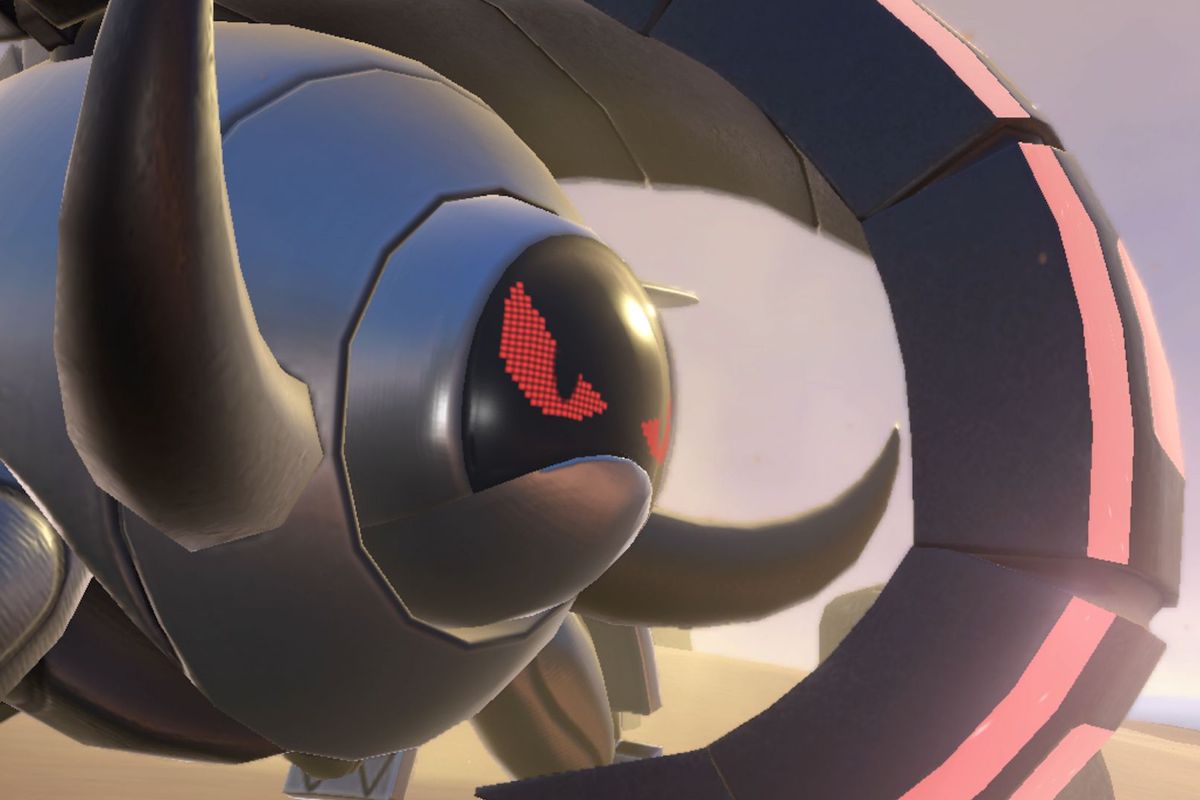 A mysterious, mechanical Pokémon known as Iron Treads. It’s got a glowing red eyes and a big tusk protruding from its body.