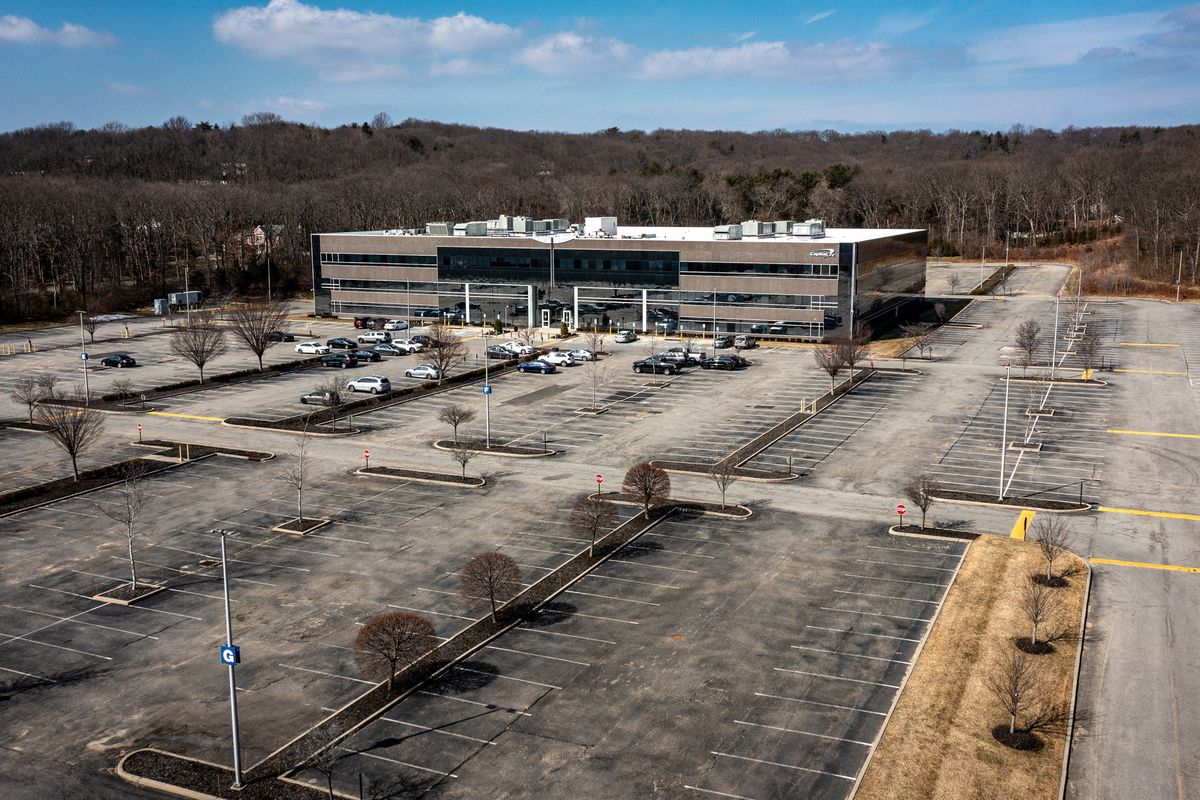 Aerial view of an large empty parking lot outside Capital One office building in Melville, New York, on March 2, 2022