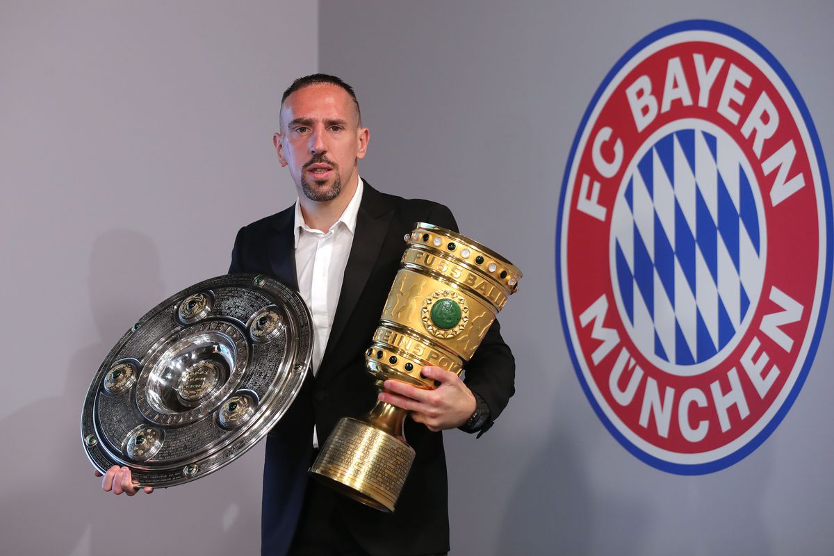 Arjen Robben And Franck Ribery Hand Over Championship And DFB Cup Trophy To FCB Erlebniswelt