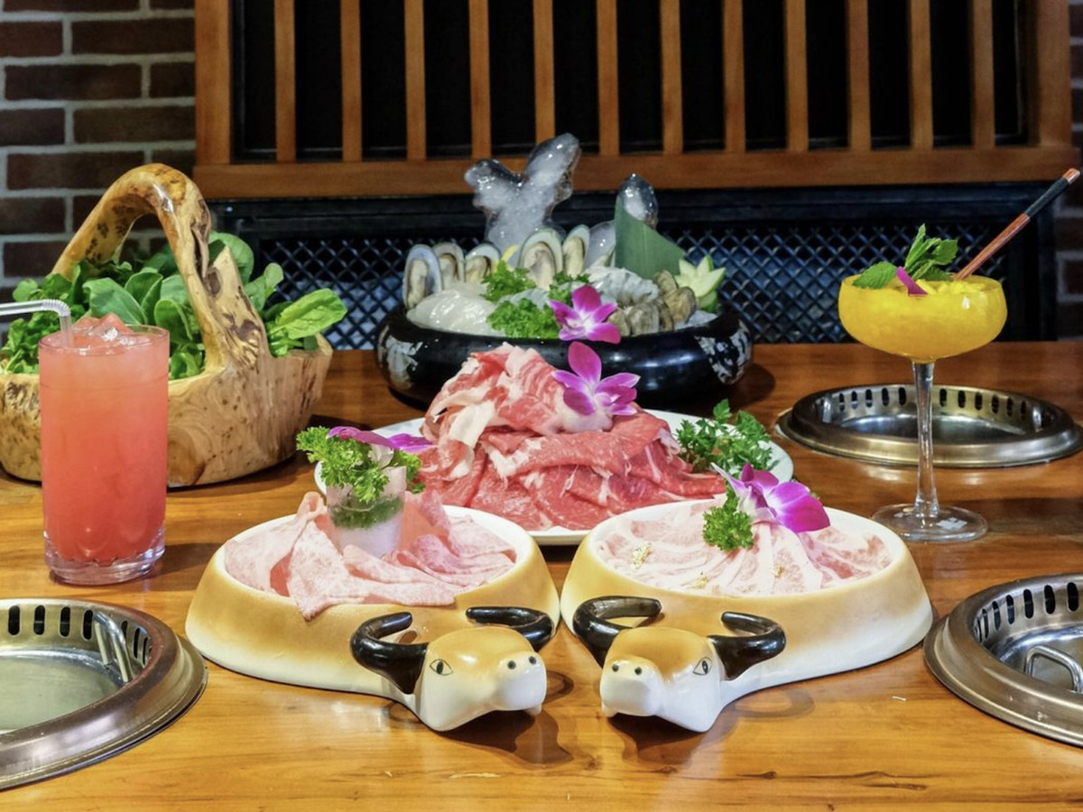 Raw meat for hot pot, sushi, and cocktails on a main table. 