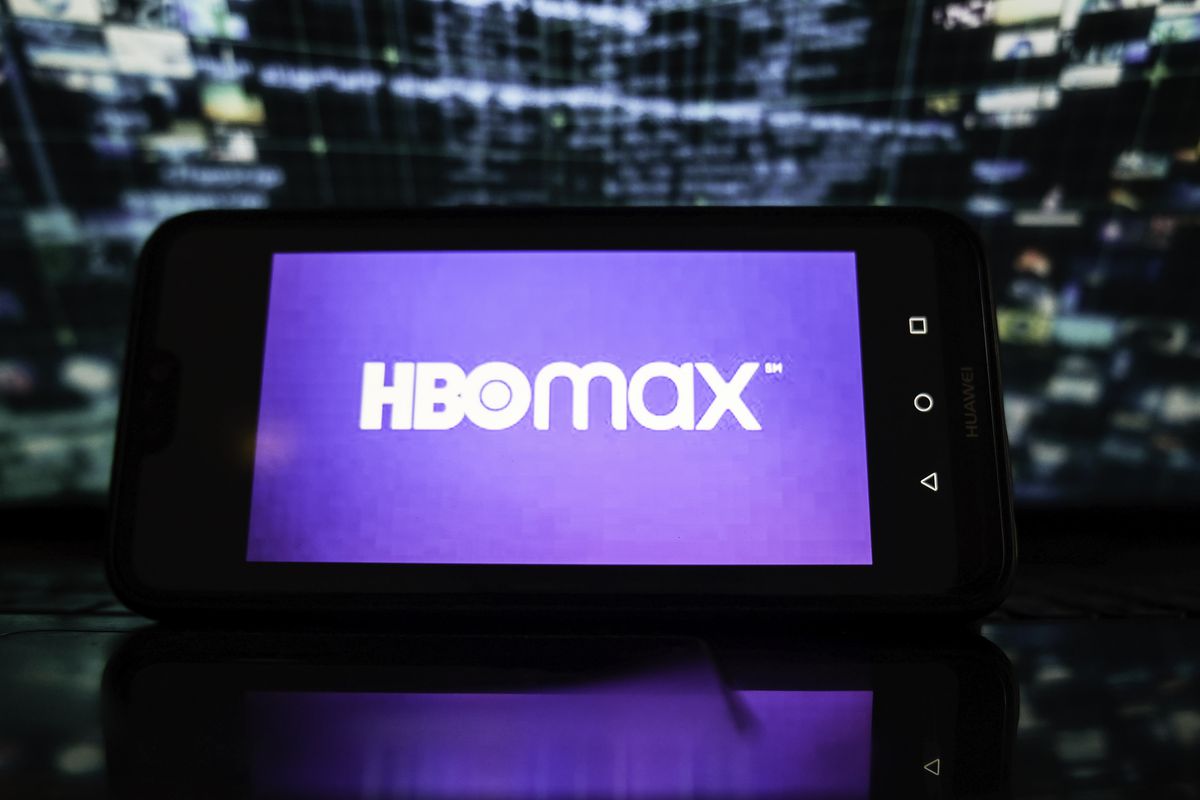 In this photo illustration, HBO MAX logo is displayed on a...