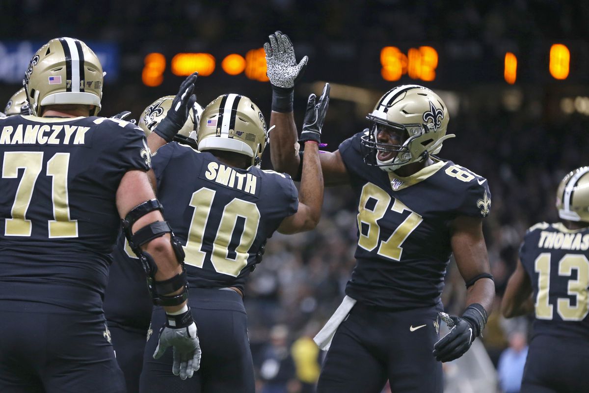 New Orleans Saints tight end Jared Cook celebrates after wide receiver Tre’Quan Smith’s touchdown catch in the first quarter against the Carolina Panthers at the Mercedes-Benz Superdome.&nbsp;