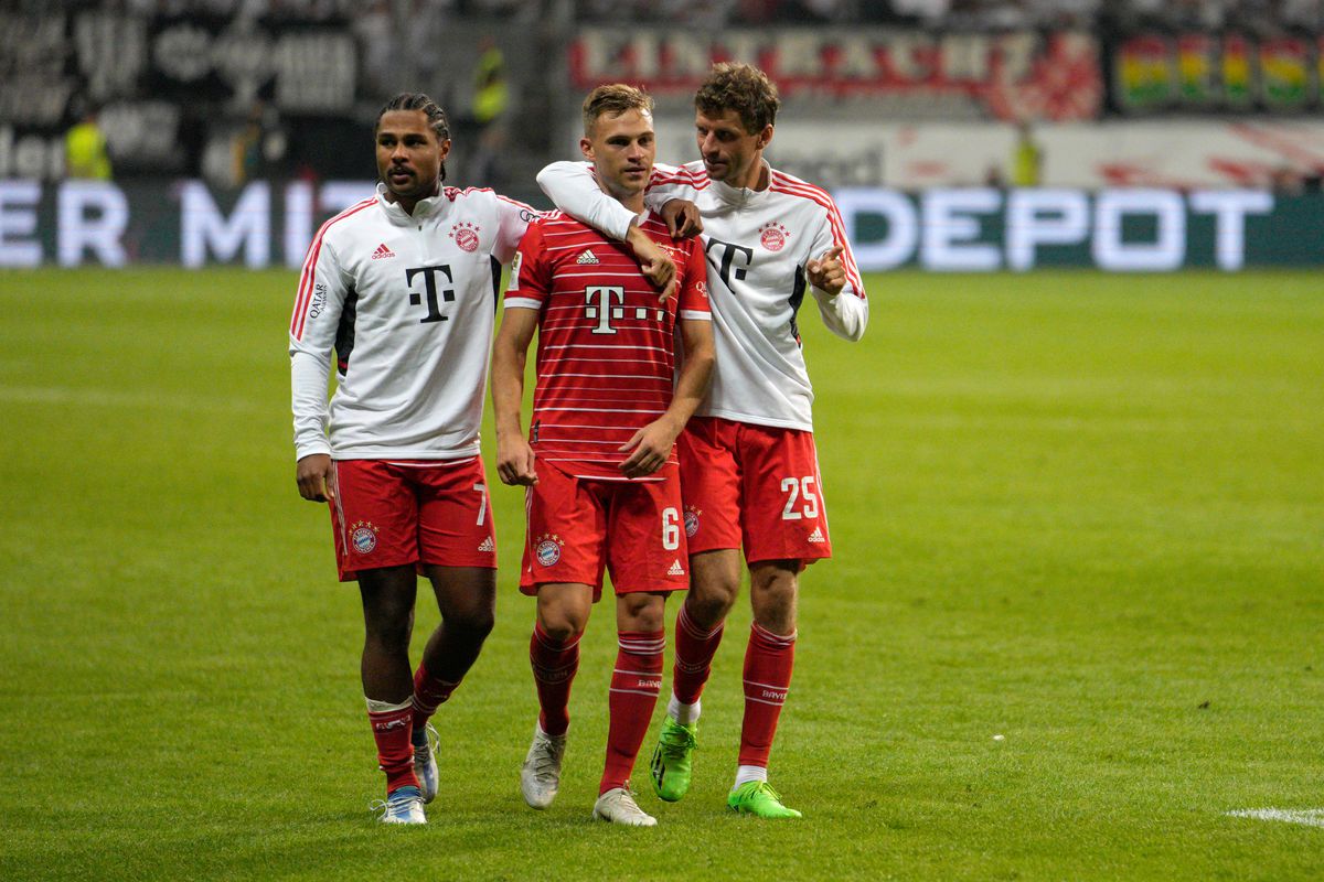 Serge Gnabry and Thomas Müller wrap their arms around Kimmich as the trio walk off the field after the opening-day win against Frankfurt.