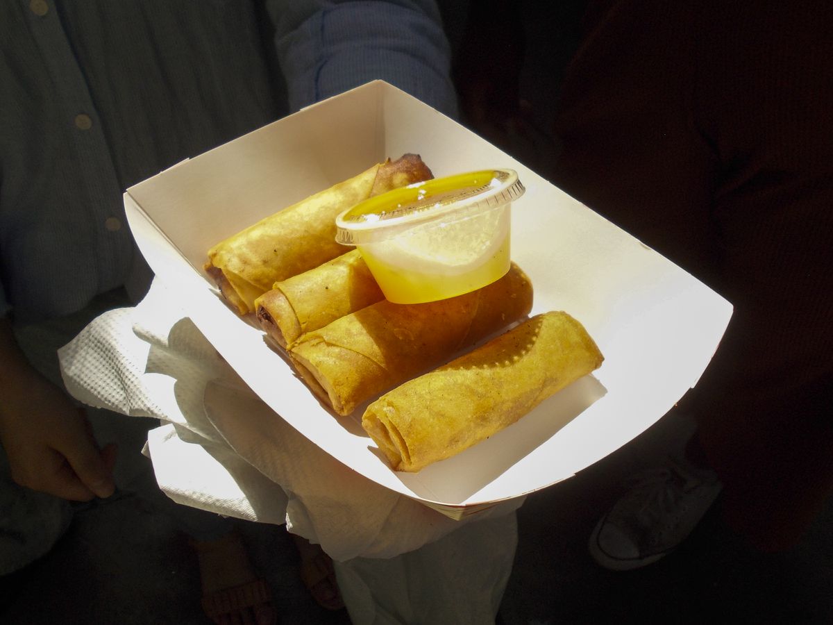 A fresh batch of rolls in a paper tray at the Night Market at Eastern Market, in Detroit, Michigan.
