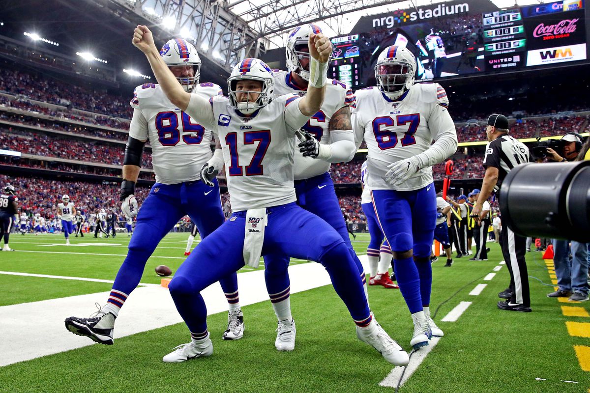 Buffalo Bills quarterback Josh Allen celebrates after scoring a touchdown d...