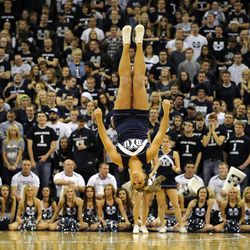 A member of the Brigham Young cheer squad perform in a break during a game at EnergySolutions Arena on Saturday, November 30, 2013.