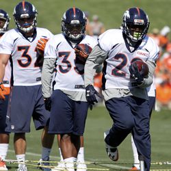 Denver Broncos RBs (R to L) C.J. Anderson, Kapri Bibbs, FB Andy Janovich, and RB Juwan Thompson work their feet through the ropes on the first day of Training Camp.