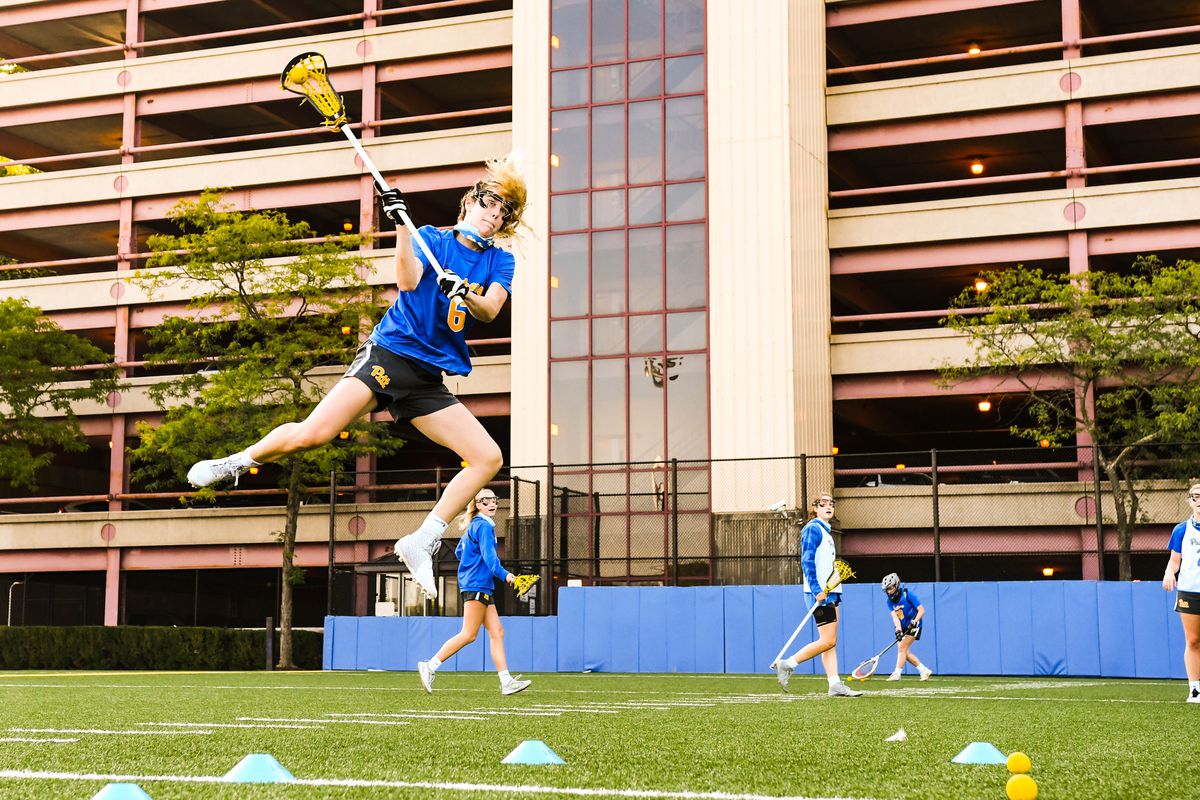 Therese Pitman goes high during lacrosse practice at Pitt.