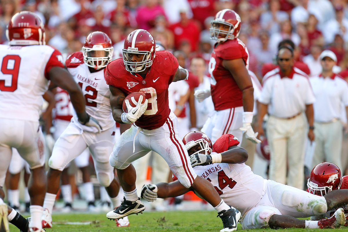 TUSCALOOSA, AL - SEPTEMBER 24:  Trent Richardson #3 of the Alabama Crimson Tide breaks a tackle by Byran Jones #54 of the Arkansas Razorbacks at Bryant-Denny Stadium on September 24, 2011 in Tuscaloosa, Alabama.  (Photo by Kevin C. Cox/Getty Images)