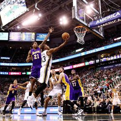 Utah Jazz guard Elijah Millsap (13) puts up a shot with Los Angeles Lakers forward Ed Davis (21) defending as the Jazz and the Lakers play Wednesday, Feb. 25, 2015, at EnergySolutions Arena in Salt Lake City.