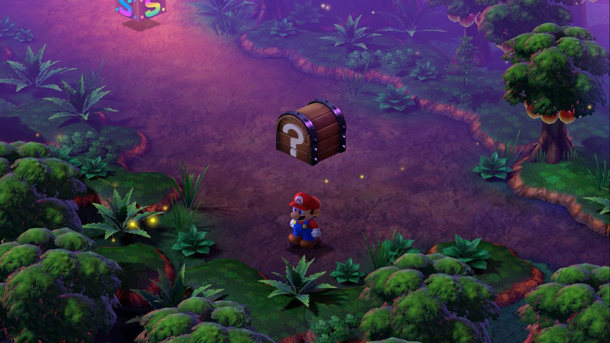 Mario stands under a chest in the Forest Maze near a save block in Super Mario RPG.