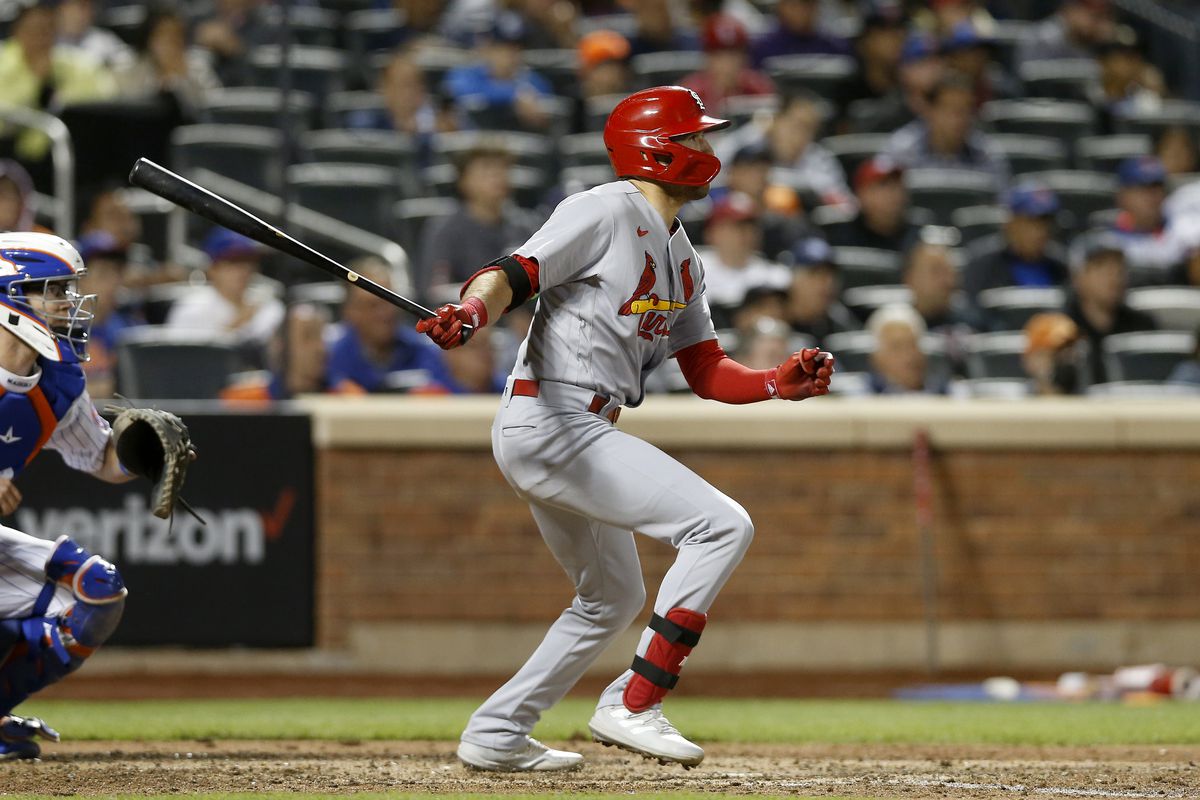 Dylan Carlson #3 of the St. Louis Cardinals follows through on a base hit in the sixth inning against the New York Mets at Citi Field on May 18, 2022 in New York City. The Mets defeated the Cardinals 11-4.