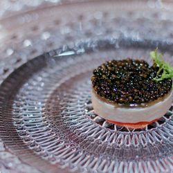 Osetra caviar topped with plantain, papaya, and rum Bavarian cream.