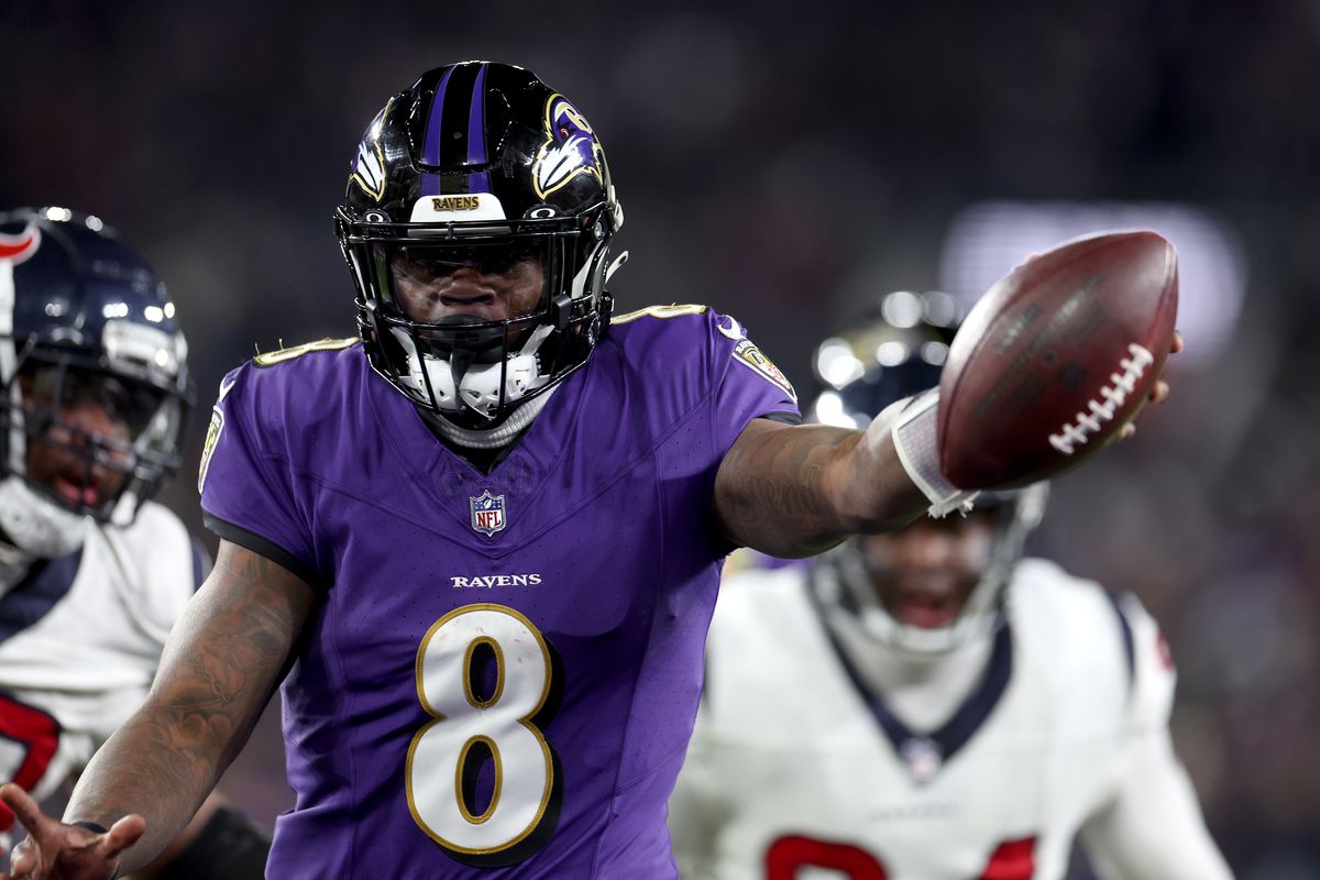 Lamar Jackson of the Baltimore Ravens celebrates after rushing for a touchdown against the Houston Texans during the fourth quarter in the AFC Divisional Playoff game at M&amp;T Bank Stadium on January 20, 2024 in Baltimore, Maryland.