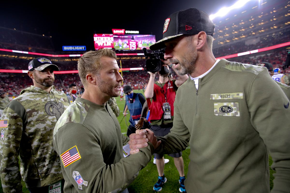 Head Coach Sean McVay of the Los Angeles Rams and Head Coach Kyle Shanahan of the San Francisco 49ers shake hands on the field after the game at Levi’s Stadium on November 15, 2021 in Santa Clara, California.
