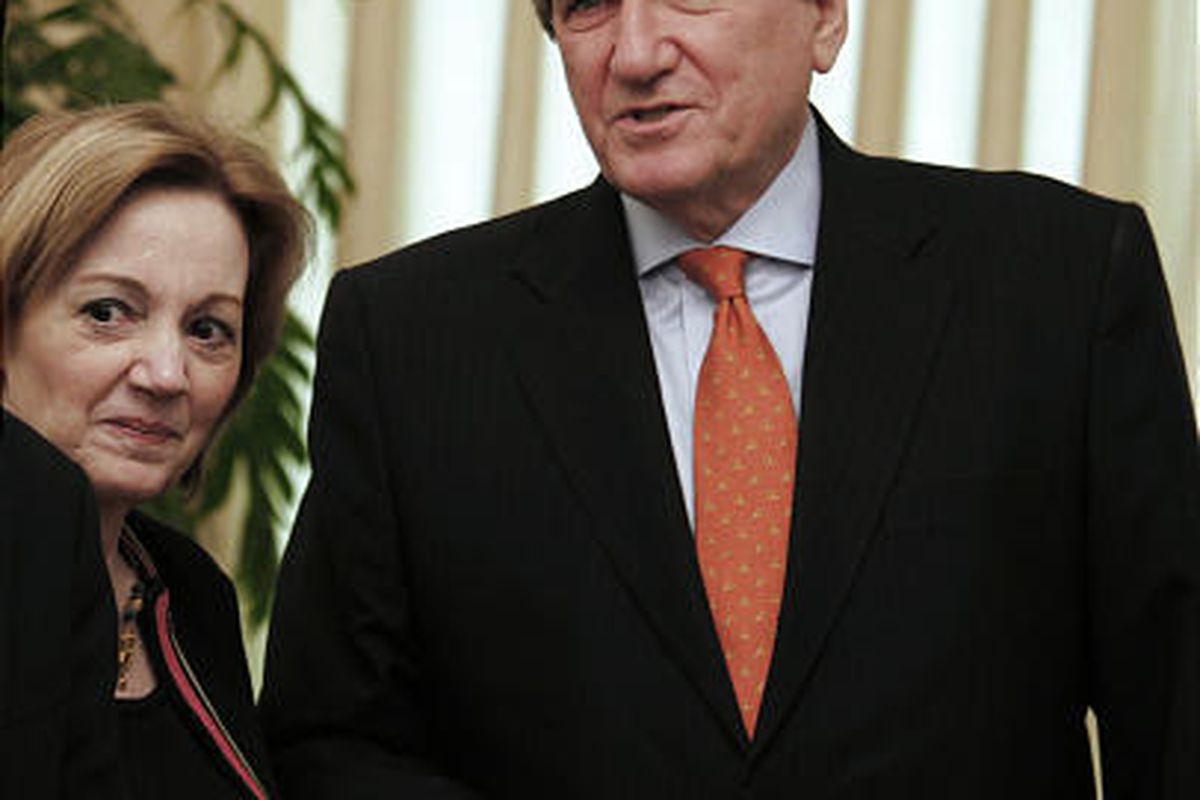 Richard Holbrooke, right, U.S. envoy to Afghanistan and Pakistan waits for Pakistan's Prime Minister Yousuf Raza Gilani, unseen, with Anne Peterson, the U.S. Ambassador in Pakistan, in Islamabad, Pakistan on Thursday, Feb. 18, 2010.