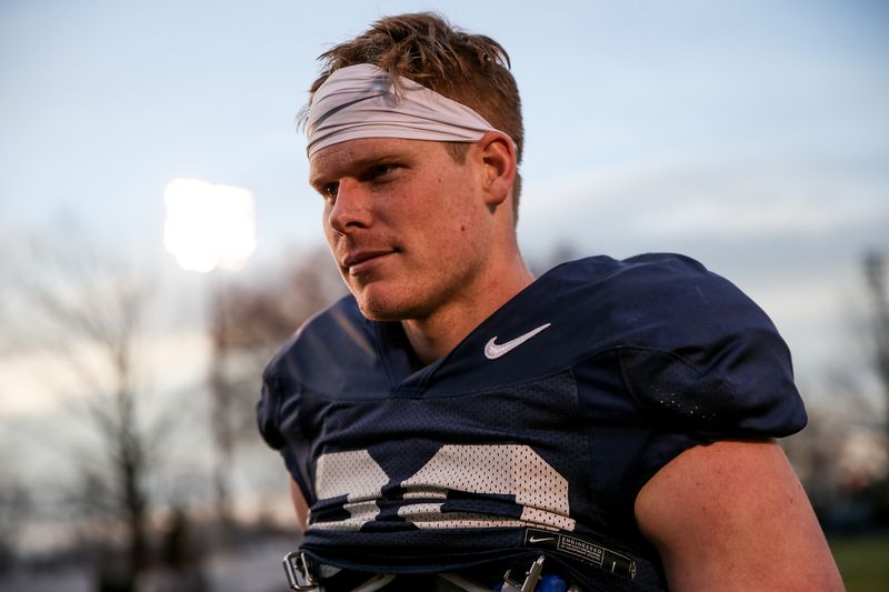 Tight end Matt Bushman walks off the field after a Brigham Young University football practice in Provo on Friday, March 6, 2020.