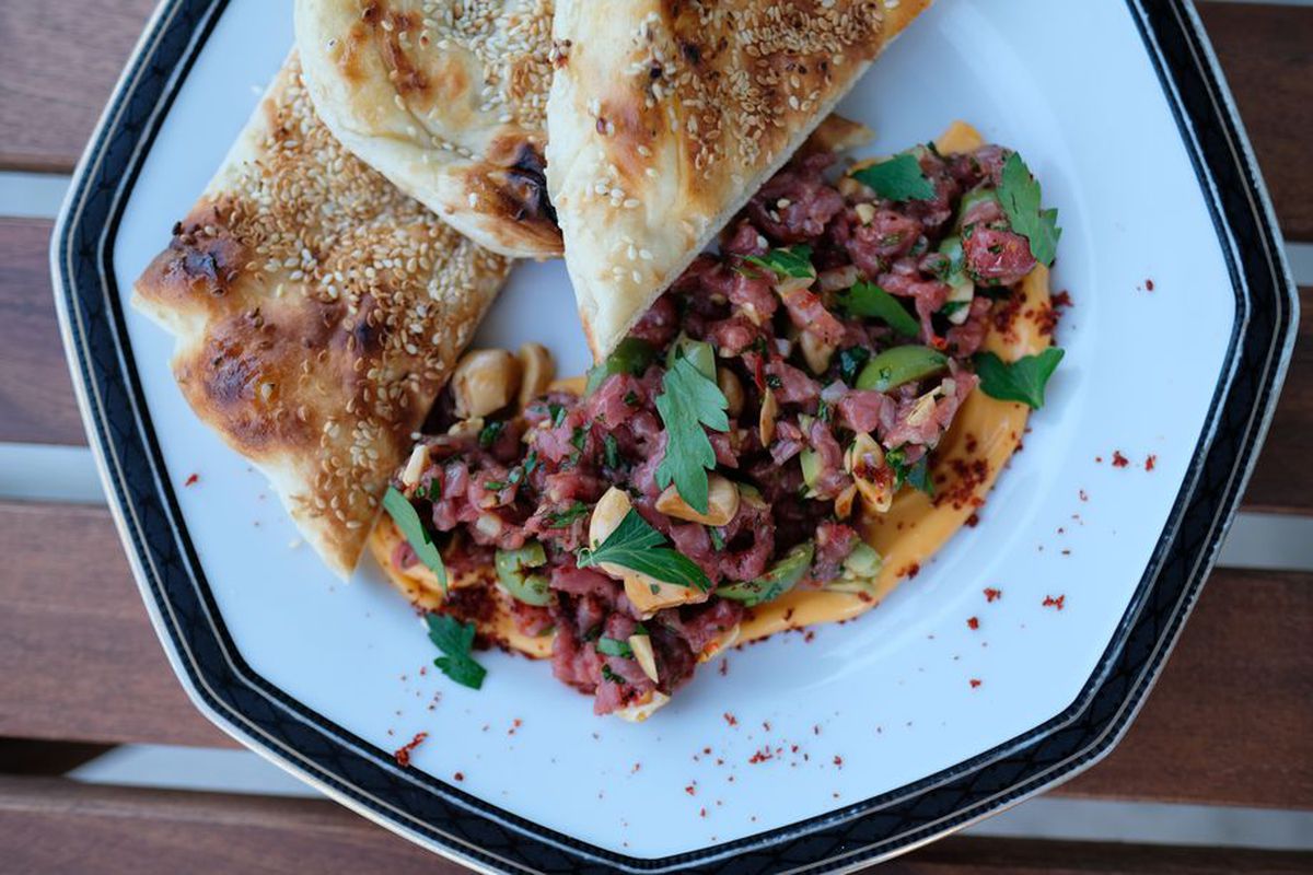 a plate of naan and lamb tartare