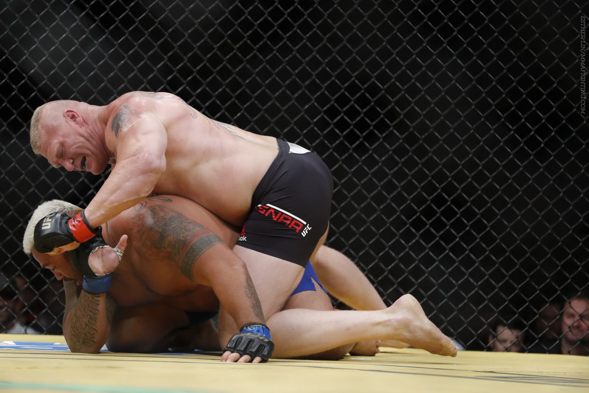 Brock Lesnar lands punches on Mark Hunt at UFC 200
