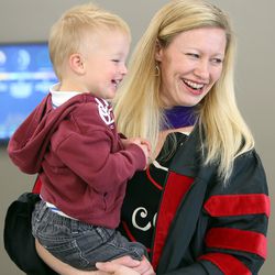 Kim Reeves holds son Gunnar at a commencement reception at the University of Utah's S.J. Quinney College of Law in Salt Lake City on Friday, May 11, 2018.