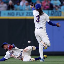 Julio Rodriguez #44 and J.P. Crawford #3 of the Seattle Mariners nearly collide on a double by Mike Zunino #10 of the Cleveland Guardians (not pictured) during the seventh inning at T-Mobile Park on April 02, 2023 in Seattle, Washington.