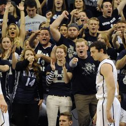 The Utah State Aggies student body calls out Brigham Young Cougars guard Matt Carlino (2) after he drew a foul during a game at EnergySolutions Arena on Saturday, November 30, 2013.