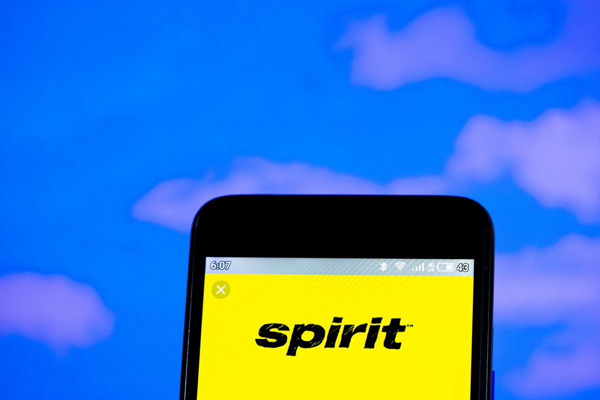 The Spirit Airlines logo on a smartphone.