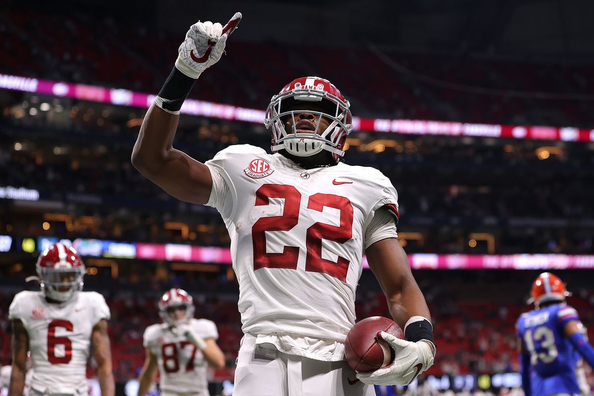Najee Harris of the Alabama Crimson Tide reacts after rushing for a touchdown against the Florida Gators during the first half of the SEC Championship at Mercedes-Benz Stadium on December 19, 2020 in Atlanta, Georgia.