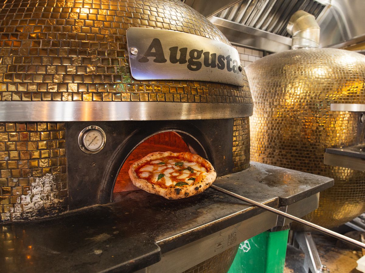 Pizza coming out of the oven at Buona Forchetta