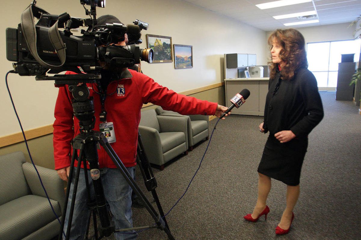 Jordan School District communications director Sandy Riesgraf speaks with the media.