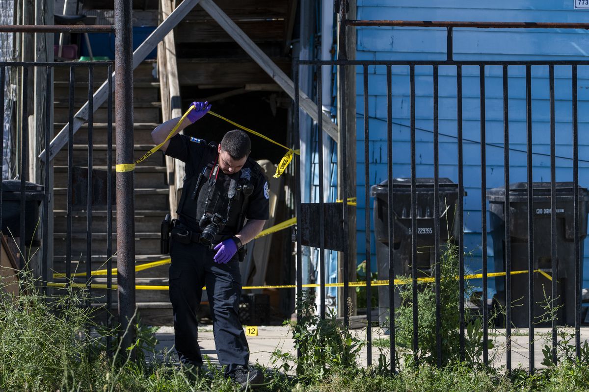 Chicago police work the scene where a 14-year-old by was shot and killed in the 1100 block of South Karlov Ave, in the Lawndale neighborhood, Thursday, June 10, 2021. | Tyler LaRiviere/Sun-Times
