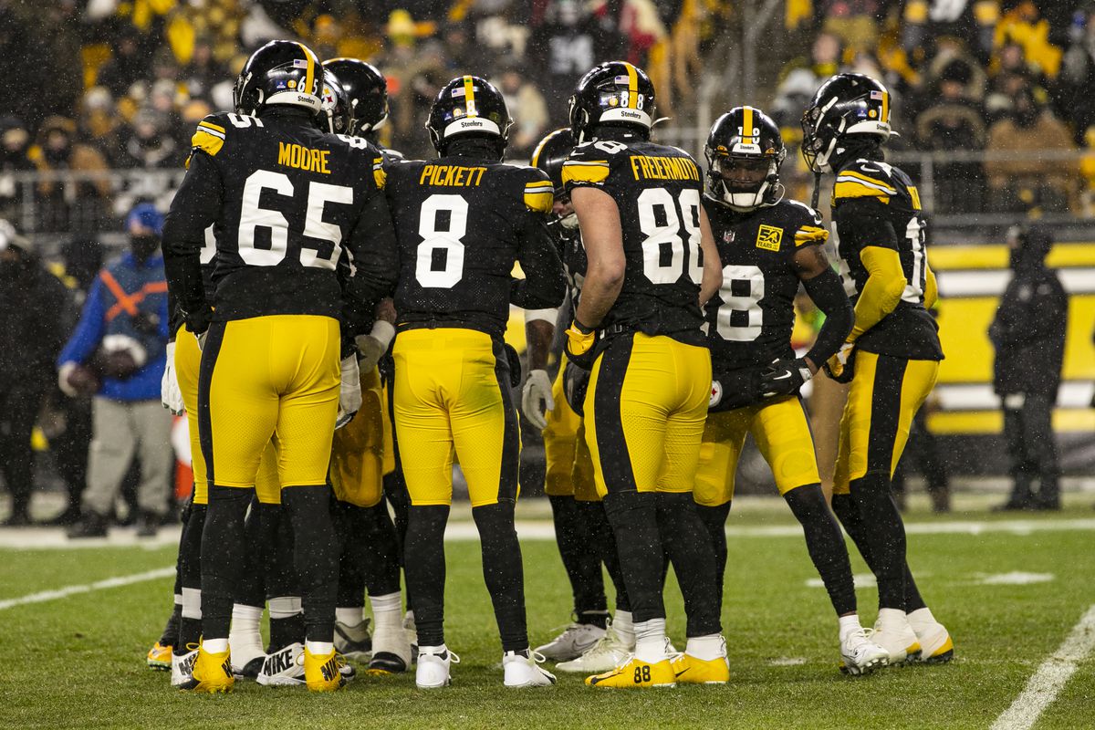Pittsburgh Steelers quarterback Kenny Pickett (8) calls a play in the huddle during the national football league game between the Las Vegas Raiders and the Pittsburgh Steelers on December 24, 2022 at Acrisure Stadium in Pittsburgh, PA. 