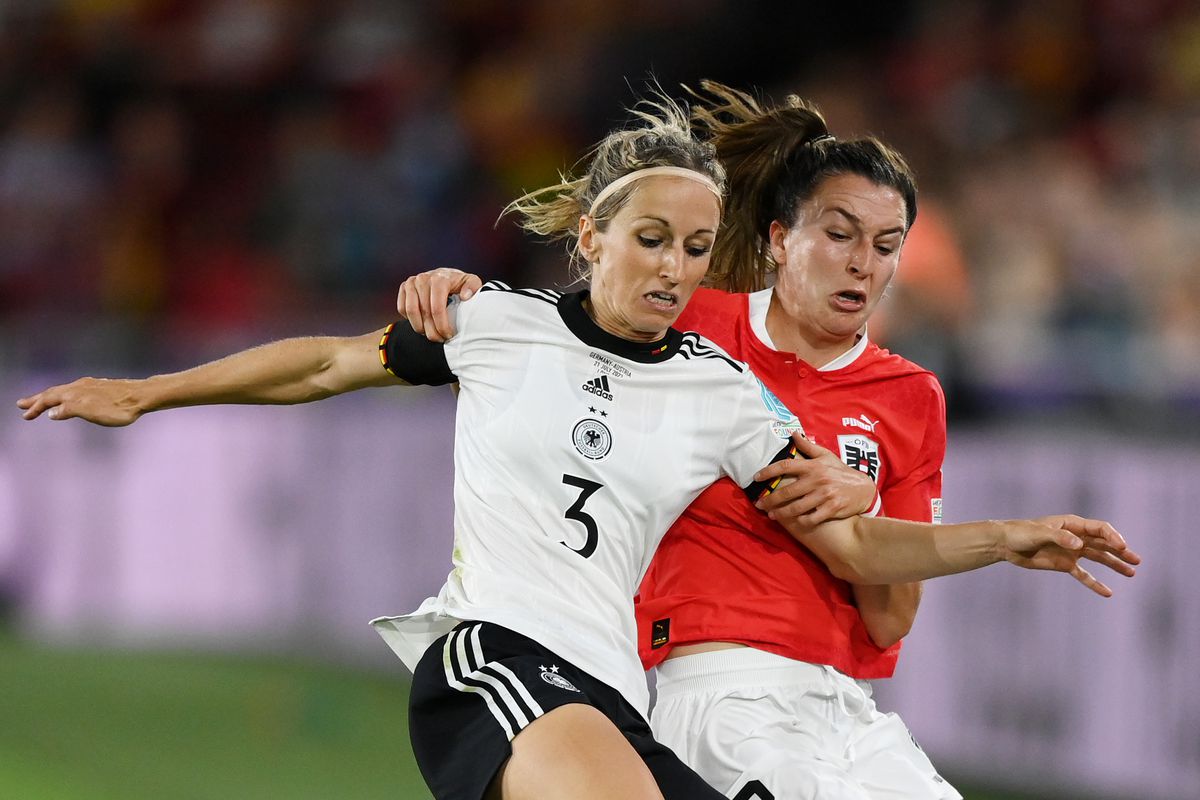Kathrin-Julia Hendrich battles on the sideline with Austria’s Barbara Dunst during the frist half of Germany-Austria