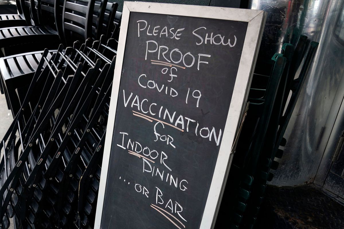 A sign is viewed at a restaurant in New York’s Upper West Side on the first day where you have to show proof of a Covid-19 vaccination to participate in indoor dining.&nbsp;