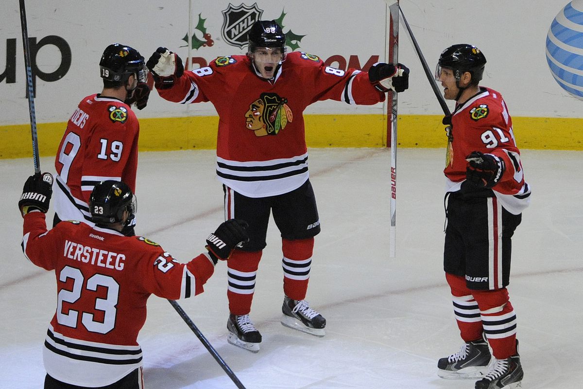 The Hawks celebrate scoring a goal because it makes them happy.