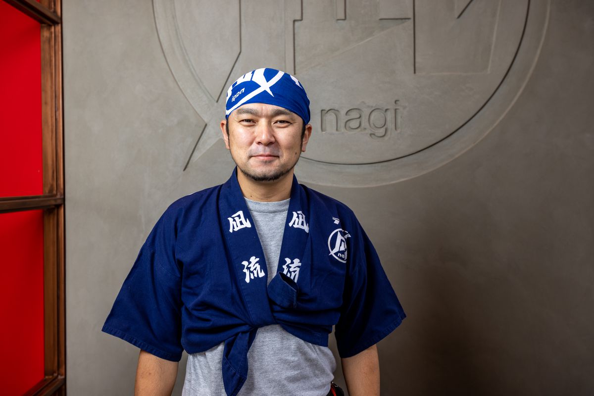 A Japanese man in a chef outfit.