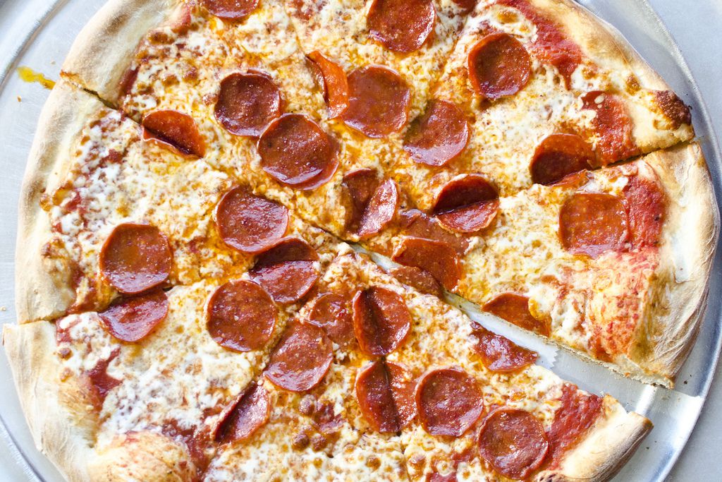 Overhead view of a New York-style pepperoni pizza