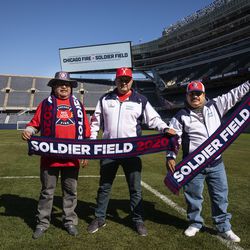 (From left) Season ticket holders Javier Madriz, Raul Jimenez and Javier Barcenas pose for a photo after it was announced that the Chicago Fire Soccer Club will be returning to Soldier Field beginning with the 2020 season, Tuesday morning, Oct. 8, 2019.