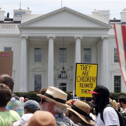 Activists march past the White House to protest the Trump administration's approach to illegal border crossings and separation of children from immigrant parents, Saturday, June 30, 2018, in Washington. (AP Photo/Alex Brandon)